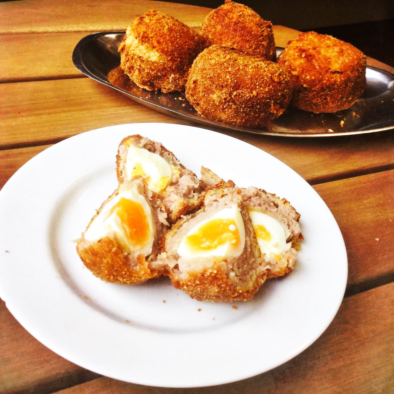 A plate of home made scotch eggs.