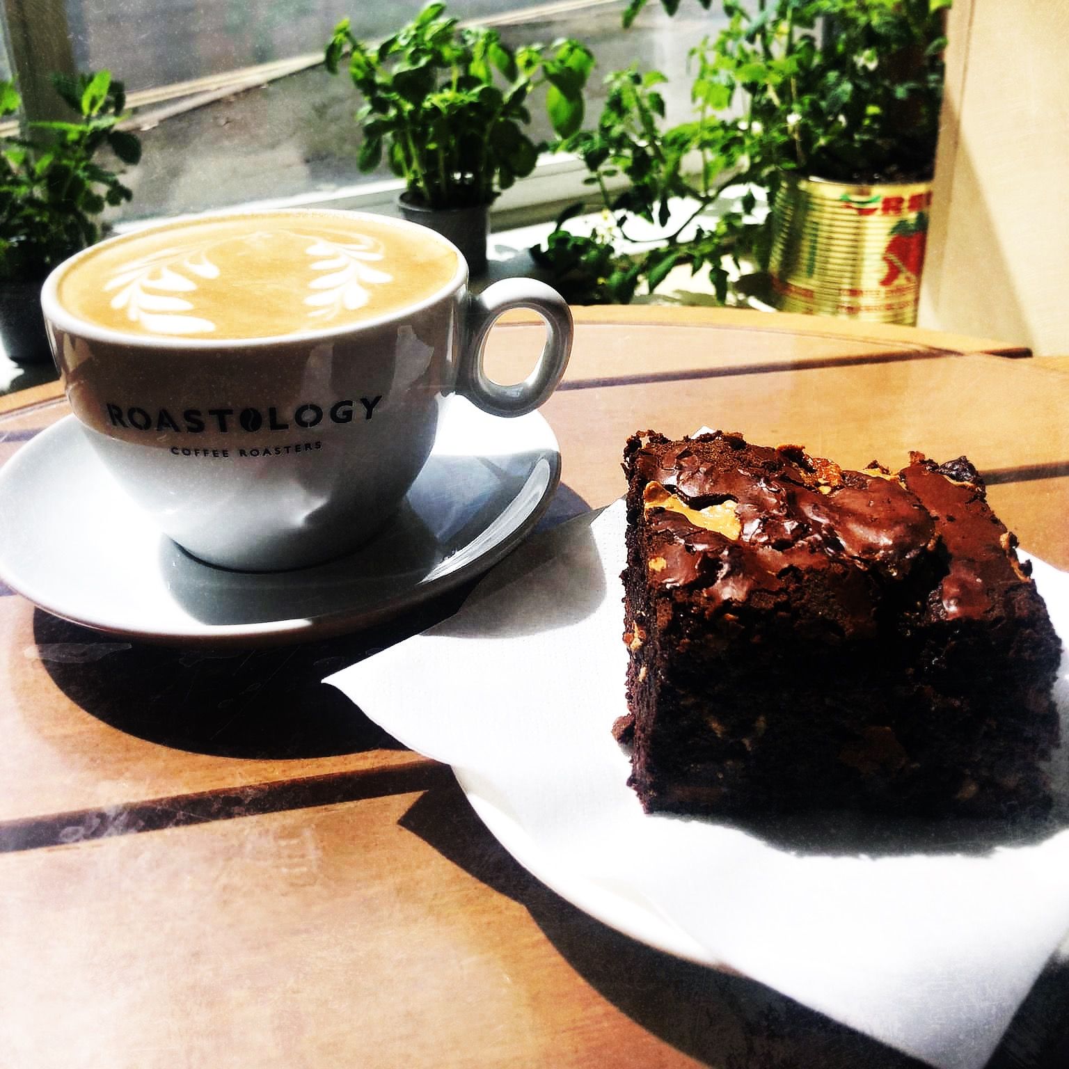A freshly brewed roastology coffee and a home made chocolate brownie at Kuchene Deli, Dronfield.